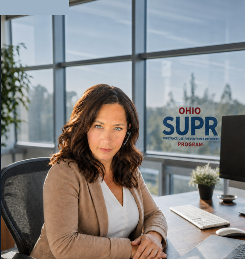 Compliance Assistance Specialist at desk
